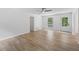 Bright, spacious living room with fresh white walls and new laminate flooring at 3345 Bomar Rd, Douglasville, GA 30135