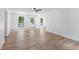 Living room featuring laminate flooring, a ceiling fan and lots of natural light at 3345 Bomar Rd, Douglasville, GA 30135