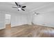 Hardwood living room with closet, stairs, and exterior door for easy outdoor access and natural light at 3345 Bomar Rd, Douglasville, GA 30135