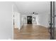 Bright living room with a fireplace, ceiling fan, and wood-look laminate flooring at 3345 Bomar Rd, Douglasville, GA 30135