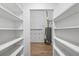 Large pantry with ample shelving offers great storage space with an adjacent closet and water heater at 3345 Bomar Rd, Douglasville, GA 30135