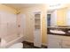 Bathroom featuring a tub/shower combo, vanity, and storage at 3349 Lavista Dr, Atlanta, GA 30354