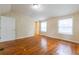 Bedroom featuring hardwood floors, a connecting door and two windows at 3349 Lavista Dr, Atlanta, GA 30354