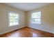 This bedroom features hardwood floors, neutral walls, and two windows that let in plenty of natural light at 3349 Lavista Dr, Atlanta, GA 30354