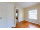 Bedroom featuring hardwood floors, a connecting door and a single window at 3349 Lavista Dr, Atlanta, GA 30354
