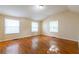 Spacious bedroom with gleaming hardwood floors and two windows offering plenty of natural light at 3349 Lavista Dr, Atlanta, GA 30354