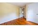 Small bedroom with hardwood flooring and entry to the hall at 3349 Lavista Dr, Atlanta, GA 30354