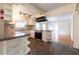 Kitchen with granite counters, black appliances, and view to the living room at 3349 Lavista Dr, Atlanta, GA 30354