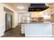 Kitchen with white cabinets and granite countertops open to living space at 3349 Lavista Dr, Atlanta, GA 30354