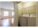 A laundry room includes a washer, a dryer, and a shelving unit at 3349 Lavista Dr, Atlanta, GA 30354