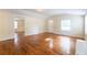 Inviting living room featuring hardwood floors, a front door, and access to other rooms at 3349 Lavista Dr, Atlanta, GA 30354