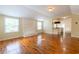Bright living room with hardwood floors, fireplace, and a view into the kitchen at 3349 Lavista Dr, Atlanta, GA 30354