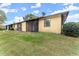 Rear exterior view of home showing a spacious fenced backyard and large mature trees at 1101 New Horizon St, Powder Springs, GA 30127