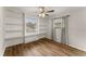 Bedroom with wood-look floors, built-in shelving, and neutral paint at 1101 New Horizon St, Powder Springs, GA 30127