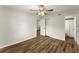 Bedroom features wood-look floors, closet, and access to bathroom at 1101 New Horizon St, Powder Springs, GA 30127