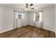 Bedroom with wood-look floors, ceiling fan, and natural light at 1101 New Horizon St, Powder Springs, GA 30127