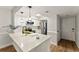Modern kitchen featuring stainless steel appliances, white cabinets, and a stylish quartz countertop at 1101 New Horizon St, Powder Springs, GA 30127