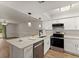 Bright, updated kitchen with stainless appliances, white cabinets, and elegant pendant lighting at 1101 New Horizon St, Powder Springs, GA 30127