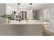 Stylish kitchen with white cabinets, stainless steel appliances, and breakfast bar area at 1101 New Horizon St, Powder Springs, GA 30127