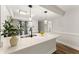 Bright kitchen with white cabinets, stainless steel appliances, and modern quartz countertops at 1101 New Horizon St, Powder Springs, GA 30127