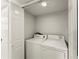 Laundry room with washer and dryer hookups and storage shelves at 1101 New Horizon St, Powder Springs, GA 30127
