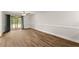 Spacious living room featuring new flooring, neutral paint, and sliding doors to outdoor space at 1101 New Horizon St, Powder Springs, GA 30127