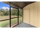 Screened in porch with views of the lawn and trees at 1101 New Horizon St, Powder Springs, GA 30127
