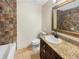 Bathroom featuring granite countertop, classic vanity, and shower-tub combination at 2784 Williamsburg Way, Decatur, GA 30034