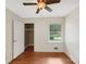 Cozy bedroom with hardwood floors, ceiling fan, and closet at 2784 Williamsburg Way, Decatur, GA 30034