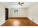 Bright bedroom with a ceiling fan and mirrored closet doors at 2784 Williamsburg Way, Decatur, GA 30034