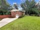 Brick home exterior with an attached garage and driveway at 2784 Williamsburg Way, Decatur, GA 30034