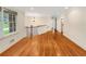 Open living space with hardwood floors, large windows, and elegant chandelier at 2784 Williamsburg Way, Decatur, GA 30034