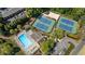 Aerial view of community pool, tennis courts, sand volleyball court, playground and parking at 3402 Johnson Ferry Rd, Roswell, GA 30075