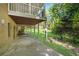 Spacious covered back patio and lush green lawn offer an ideal outdoor living space at 3402 Johnson Ferry Rd, Roswell, GA 30075