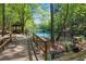 Picturesque backyard view of bridge to gazebo overlooking a beautiful pond at 3402 Johnson Ferry Rd, Roswell, GA 30075