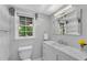 Bathroom features a modern vanity with marble countertop and chrome faucet at 3402 Johnson Ferry Rd, Roswell, GA 30075