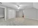 Neutral bedroom featuring carpeted floor, ceiling fan, and closets for ample storage at 3402 Johnson Ferry Rd, Roswell, GA 30075