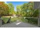Inviting outdoor deck overlooking a lush, green backyard, perfect for outdoor relaxation at 3402 Johnson Ferry Rd, Roswell, GA 30075