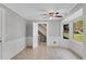 Bright dining area features tile floors, a ceiling fan, and windows with a view of the outdoors at 3402 Johnson Ferry Rd, Roswell, GA 30075