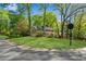 Well-manicured lawn of a lovely brick home at the corner of Johnson Ferry Road at 3402 Johnson Ferry Rd, Roswell, GA 30075