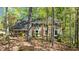 Charming brick home with well-manicured front yard and mature trees at 3402 Johnson Ferry Rd, Roswell, GA 30075
