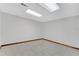 A large room with white walls and tile flooring at 3402 Johnson Ferry Rd, Roswell, GA 30075
