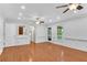Bright living room featuring hardwood floors and classic white wainscoting at 3402 Johnson Ferry Rd, Roswell, GA 30075