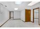 A bright living room with tile flooring, white walls, and two doorways at 3402 Johnson Ferry Rd, Roswell, GA 30075