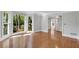 Bright living room with hardwood floors, large bay window, and neutral wall colors at 3402 Johnson Ferry Rd, Roswell, GA 30075