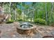 Beautiful backyard with a pool, spa, and stone patio, perfect for relaxation and entertaining at 4012 Ironhill Ln, Woodstock, GA 30189