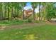 Expansive backyard offers privacy with wooded views, backing to the green space at 4012 Ironhill Ln, Woodstock, GA 30189