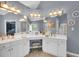 Bright primary bathroom with dual sinks, vanity, and great lighting at 4012 Ironhill Ln, Woodstock, GA 30189