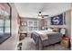 Bedroom with neutral colors, carpet, ceiling fan, and natural light at 4012 Ironhill Ln, Woodstock, GA 30189