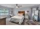 Cozy bedroom with a light color scheme, ceiling fan, and carpeted floors at 4012 Ironhill Ln, Woodstock, GA 30189